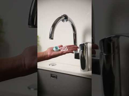 Close-up of installing the ÔFltr faucet water filter on a modern kitchen tap with no tools required.